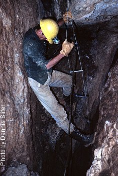 Negotiating a drop in Round Top Summit Cave (photo by Dennis Slifer)